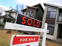 A home for sale and sold sign in Winston Heights was photographed on Tuesday, May 4, 2021. Calgary has sold a record number of homes in recent months.  Gavin Young/Postmedia