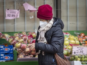A woman runs errands at the Yao Hua supermarket in Toronto.