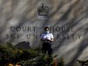 A guard stands outside the Superior Court of Justice in Toronto.