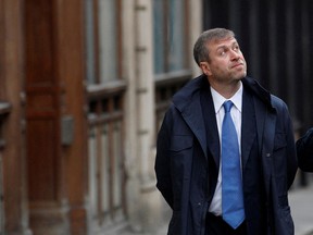 Chelsea Football Club owner Roman Abramovich walks past the High Court in London on November 16, 2011.