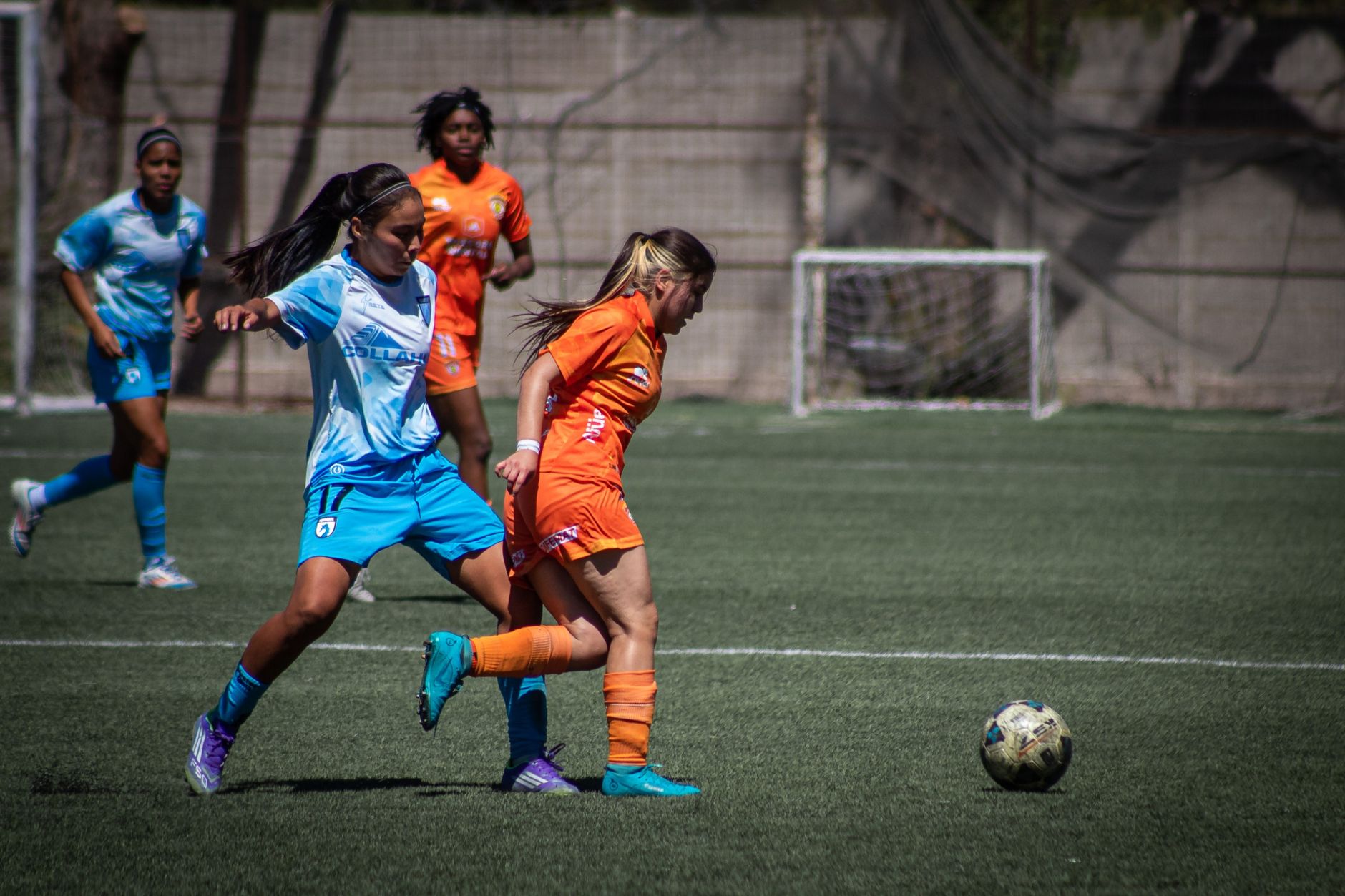 Female soccer players competing intensely on the field during a game. — A Guide to Watching Live Matches on Streameast