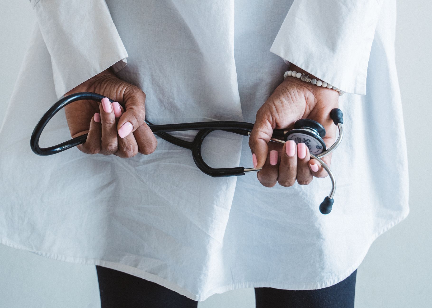 A medical professional holding a stethoscope in a clinical setting. — Devoted Medicare Advantage Plans: Enhancing Access to H