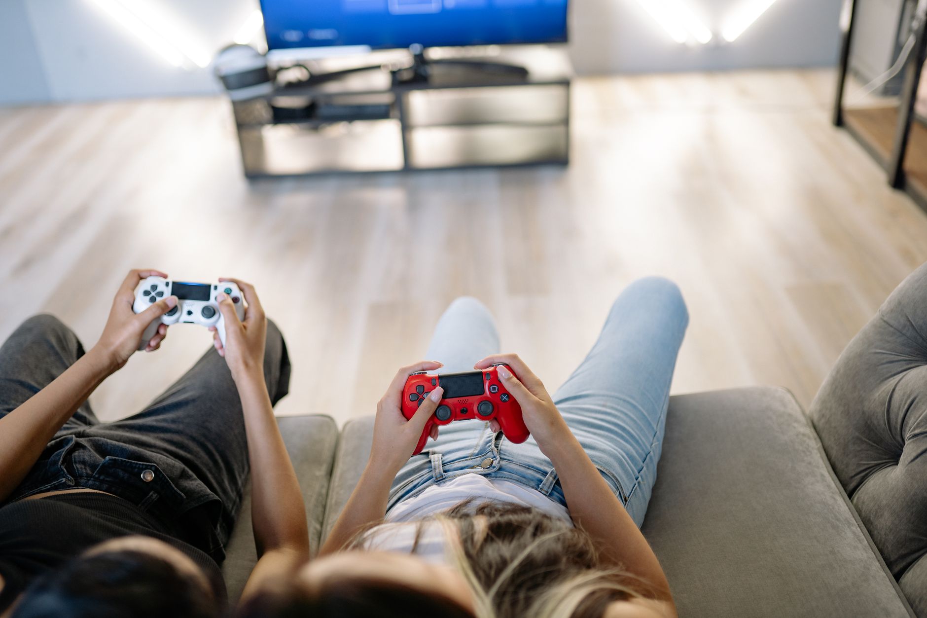 Two friends playing video games together indoors with game controllers. — Unlocking the Latest Free Promotion Bonus at Fun88